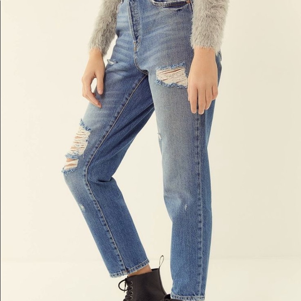 A classic slim, straight-leg jean, authentic rigid denim & distressed detailing.